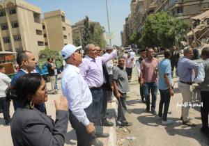انتشال إحدى الناجيات من أسفل عقار أرض الجولف المنهار بمدينة نصر