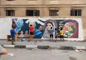 طلاب فنون جميلة المنصورة يرسمون جرافيتي لـ" نيرة أشرف " على سور الجامعة | صور